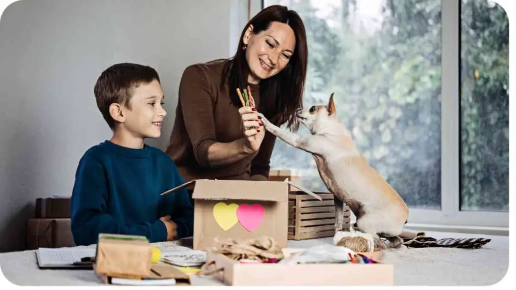 a person and a child playing with a dog in a box